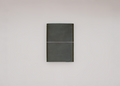 A dark olive green hardcover notebook with a thin elastic band closure, centered against a plain light gray background.